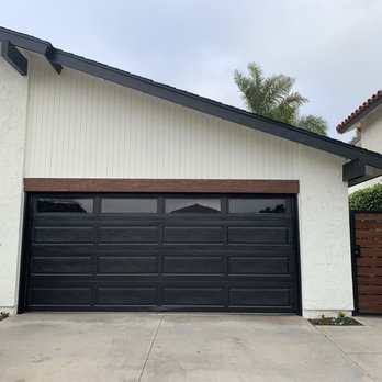 OC Local Garage Door & Gate - new iron and redwood gate, newly installed black vinyl lining around old garage door. - Garage Door Services Near Me - Costa Mesa, California OC Local Garage Door & Gate - new iron and redwood gate, newly installed black vinyl lining around old garage door. - Garage Door Services Near Me - Costa Mesa, California