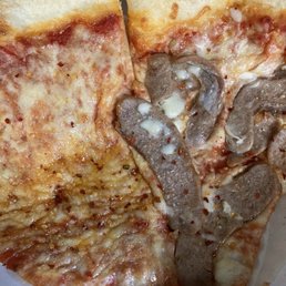 Messy slices cheese and sausage
