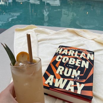 White Sands Hotel - A book and a mai tai - Hotels Near Me - Honolulu, Hawaii
