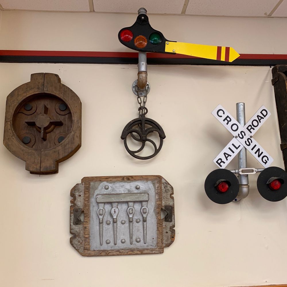 The Junction - a railroad crossing sign and other items - American Near Me - Newton, Mississippi