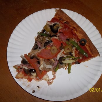 Milano Pizza - Supreme Pizza slice. This really is great thin-crust pizza. - Pizza Near Me - Austin, Texas
