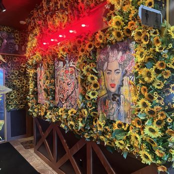 Carolina Kitchen - sunflowers and a woman's face - Soul Food Near Me - Capitol Heights, Maryland