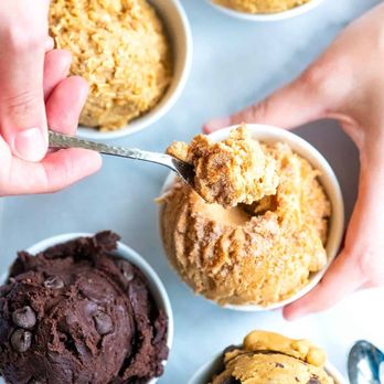 Scoop Ó Dough - a person scooping a scoop of chocolate ice cream - Desserts Near Me Scoop Ó Dough - a person scooping a scoop of chocolate ice cream - Desserts Near Me
