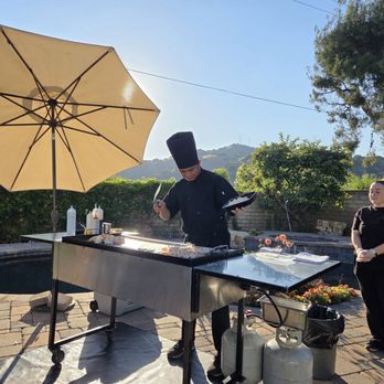 Blessed Hibachi - Chef Stevo entertaining and creating a delicious meal for us! - Caterers Near Me Blessed Hibachi - Chef Stevo entertaining and creating a delicious meal for us! - Caterers Near Me