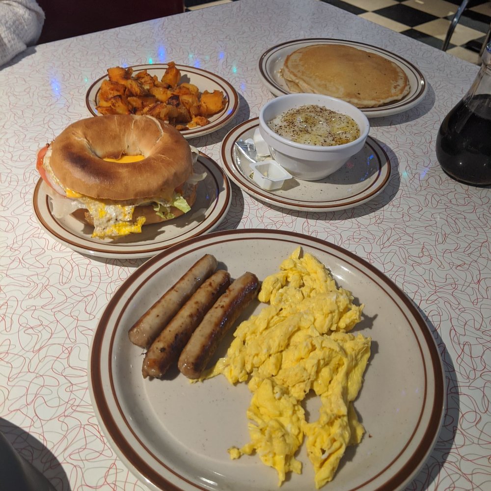 Lost In the 50s Diner - 2 eggs platter, egg and cheese bagel, grits, homefries, and short stack - Diners Near Me - Baltimore, Maryland Lost In the 50s Diner - 2 eggs platter, egg and cheese bagel, grits, homefries, and short stack - Diners Near Me - Baltimore, Maryland