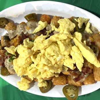 The OV Beach Tavern - Brunch poutine- tater tots, sausage gravy, bacon, jalapeños and eggs. - Sports Bars Near Me - Norfolk, Virginia The OV Beach Tavern - Brunch poutine- tater tots, sausage gravy, bacon, jalapeños and eggs. - Sports Bars Near Me - Norfolk, Virginia