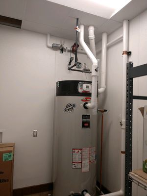 Komar Anchor Plumbing Logo