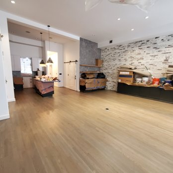 Brazil Floors - a living room with hardwood floors - Flooring Near Me