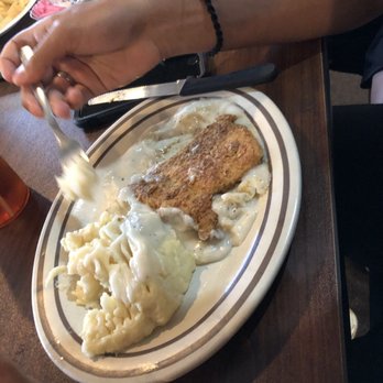 Sutton County Steak House - Chicken fried chicken getting devoured by my bf - Steakhouses Near Me - Sonora, Texas