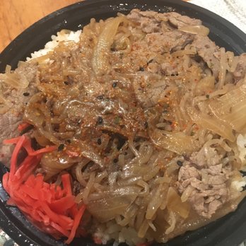 Takoyaki Balls - Gyudon: thin-sliced beef with onion on rice. Sauce has ginger. - Food Trucks Near Me Takoyaki Balls - Gyudon: thin-sliced beef with onion on rice. Sauce has ginger. - Food Trucks Near Me