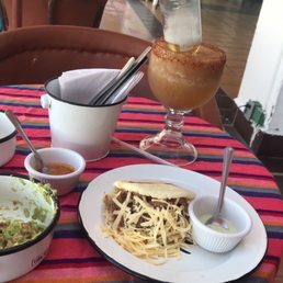 Tamarind coronarita, guac and chips and shredded beef and cheese arepa.