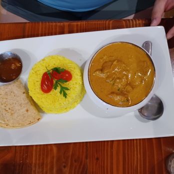 Hidden Cuisine - Cape Malay chicken curry with yellow rice, roti, and fruit chutney, $24.95. - Breakfast & Brunch Near Me - Moab, Utah Hidden Cuisine - Cape Malay chicken curry with yellow rice, roti, and fruit chutney, $24.95. - Breakfast & Brunch Near Me - Moab, Utah
