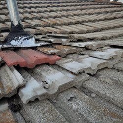 Hemet Electric - The tiles need to lie flat or they will leak!