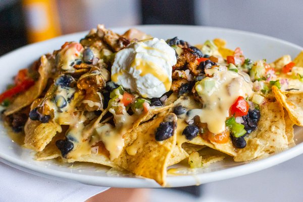 Photo of Netshed No. 9 - Gig Harbor, WA, US. Dinner Starter. IGNACHOS. Dine outside on the deck or inside the restaurant. Gig Harbor waterfront