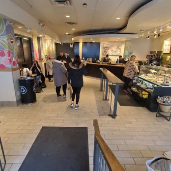 Starbucks - people walking through a coffee shop - Coffee & Tea Near Me - Forest Hills, New York Starbucks - people walking through a coffee shop - Coffee & Tea Near Me - Forest Hills, New York