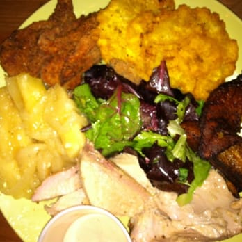 Parada 22 - sampler platter: crispy fried chicharron de pollo, fried plantain, yucca, and roasted pork - Latin American Near Me - San Francisco, California