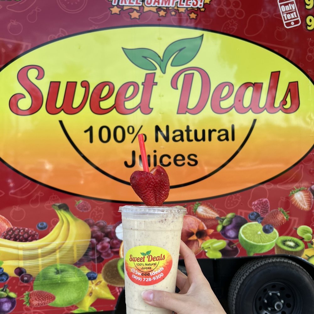Sweet Deals - a hand holding a cup of fruit juice - Juice Bars & Smoothies Near Me - Riverside, California Sweet Deals - a hand holding a cup of fruit juice - Juice Bars & Smoothies Near Me - Riverside, California