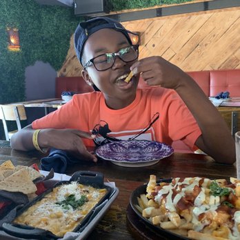 Agave - Mexican corn dip and loaded fries along with a very hungry boy! - Mexican Near Me - Red Hook, Virgin Islands