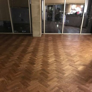 Action Pro Flooring - a hardwood floor in a living room - Flooring Near Me - Houston, Texas