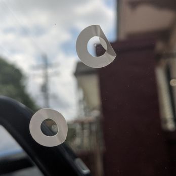 Snappy Tint - Example of the kind of debris left between the tint and window. - Home Window Tinting Near Me Snappy Tint - Example of the kind of debris left between the tint and window. - Home Window Tinting Near Me
