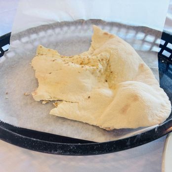 Ephesus Bistro & Grill - Half eaten pita bread, delicious! - Mediterranean Near Me - Rowlett, Texas Ephesus Bistro & Grill - Half eaten pita bread, delicious! - Mediterranean Near Me - Rowlett, Texas