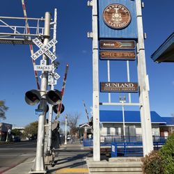 Marathon Cab - Sign In front of the Hanford Amtrak Station