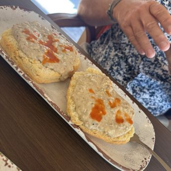 Lazy Oak - Biscuits and gravy, we added the hot sauce - Breakfast & Brunch Near Me - Ocean Springs, Mississippi Lazy Oak - Biscuits and gravy, we added the hot sauce - Breakfast & Brunch Near Me - Ocean Springs, Mississippi