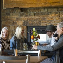 James Ranch Grill - Spacious dining with fireplace