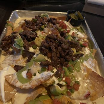 Pour Behavior - Texas-Sized Nachos - New American Near Me - Houston, Texas