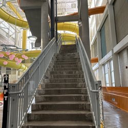 These stairs lead to 2 slides. Must be 4' tall. One slide requires a mat. (5/6/2023)