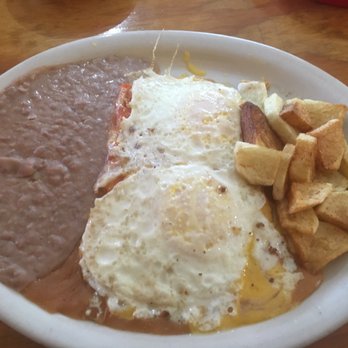 Chepo's Mexican Restaurant - Hope plate--eggs over easy and cheese enchiladas with standard sides. - Mexican Near Me - San Marcos, Texas Chepo's Mexican Restaurant - Hope plate--eggs over easy and cheese enchiladas with standard sides. - Mexican Near Me - San Marcos, Texas