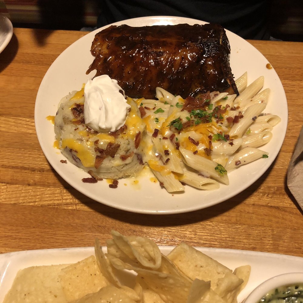 Half rack of ribs with mashed potatoes and macaroni and cheese on the side Half rack of ribs with mashed potatoes and macaroni and cheese on the side