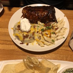 Half rack of ribs with mashed potatoes and macaroni and cheese on the side