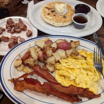 Blueberry's Cafe - Blueberry pancakes, scrambled eggs, potatoes, bacon and sausage. - Breakfast & Brunch Near Me - Naples, Florida