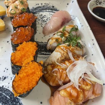 Ginza Sushi - Spicy ahi, ikura, tobiko, hamachi (one piece already eaten), garlic hamachi, and garlic salmon. Ordered Ala cart. - Sushi Bars Near Me - Honolulu, Hawaii Ginza Sushi - Spicy ahi, ikura, tobiko, hamachi (one piece already eaten), garlic hamachi, and garlic salmon. Ordered Ala cart. - Sushi Bars Near Me - Honolulu, Hawaii