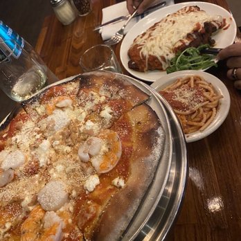 Spritzery - Frutti Di Mare in the front, Pasquale Parmigiana in the back. - Italian Near Me - Pittsburgh, Pennsylvania Spritzery - Frutti Di Mare in the front, Pasquale Parmigiana in the back. - Italian Near Me - Pittsburgh, Pennsylvania