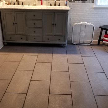 Charlie's Home Improvements - a bathroom with tile flooring - General Contractors Near Me Charlie's Home Improvements - a bathroom with tile flooring - General Contractors Near Me