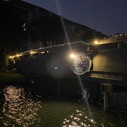 Jupiter Bay Resort Sales & Rentals - Bridge lit up over lake