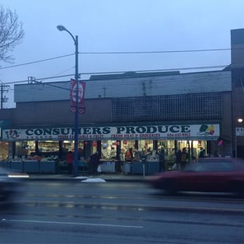 Consumers Produce - a car driving past a grocery store - Fruits & Veggies Near Me - Vancouver, British Columbia