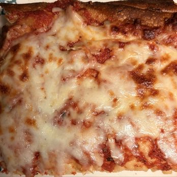 Coast Pizza - Close-up of a slice of Coast Pizza's magnificent Sicilian pizza pie - Pizza Near Me - Myrtle Beach, South Carolina