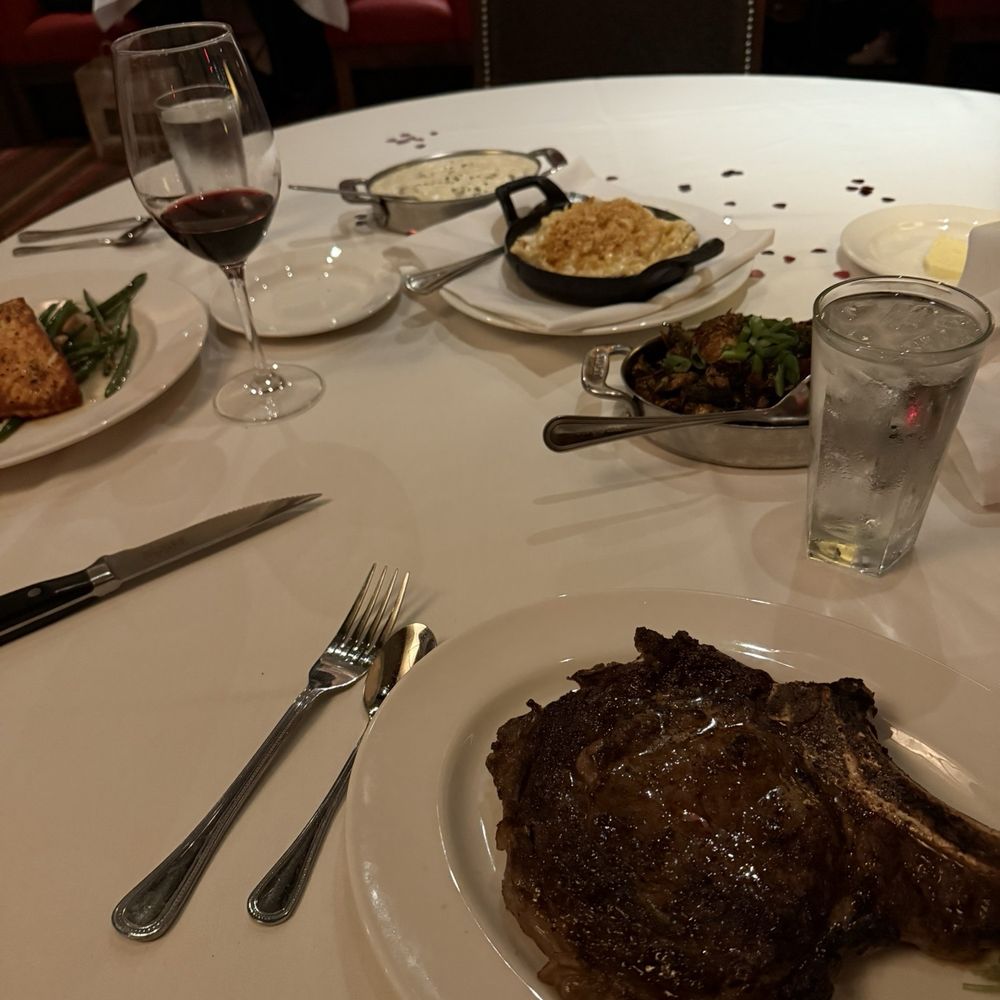 The Capital Grille - Bone-In Ribeye 22oz, Lobster Mac 'N' Cheese, Seared Citrus Glazed Salmon with Marcona Almonds and Brown Butter, Sam's Mashed Potatoes - Steakhouses Near Me - Burbank, California The Capital Grille - Bone-In Ribeye 22oz, Lobster Mac 'N' Cheese, Seared Citrus Glazed Salmon with Marcona Almonds and Brown Butter, Sam's Mashed Potatoes - Steakhouses Near Me - Burbank, California
