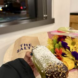 The Salty Donut - The Pistachio Cannoli is a dream--creamy white chocolate crunch on the sides and loaded with chips inside.