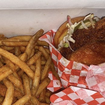 Red Claws Crab Shack - Chicken sandwich with medium spice and Cajun fries - Cajun/Creole Near Me - Dallas, Texas