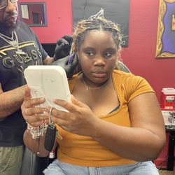 Tattooz By King - Me getting in my ear pierced.