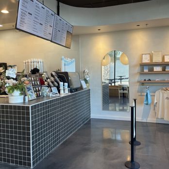 Ümacha - Ordering counter where the line is formed. Digital menu hangs from above. Merchandise shelf on the wall next to a clean mirror. - Coffee & Tea Near Me - Las Vegas, Nevada Ümacha - Ordering counter where the line is formed. Digital menu hangs from above. Merchandise shelf on the wall next to a clean mirror. - Coffee & Tea Near Me - Las Vegas, Nevada