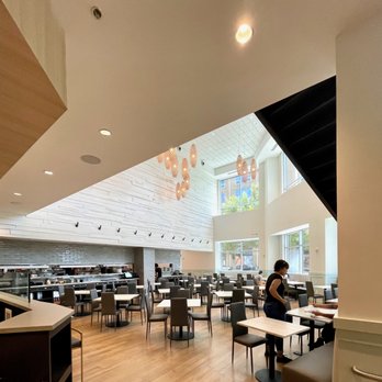 Open Rice Metropolitan - a woman sitting at a table - Asian Fusion Near Me - Charlotte, North Carolina Open Rice Metropolitan - a woman sitting at a table - Asian Fusion Near Me - Charlotte, North Carolina