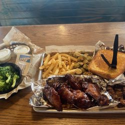 BubbaQue's - Three meats entree. Chicken Wings, brisket, St. Louis ribs, crinkled fries, fried okra and broccoli Pick Any Three Items