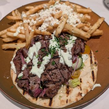Medusa Authentic Greek Cuisine - Steak on a pita with a side of Greek fries - Greek Near Me - Vaughan, Ontario Medusa Authentic Greek Cuisine - Steak on a pita with a side of Greek fries - Greek Near Me - Vaughan, Ontario