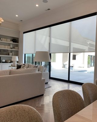 Customizable Roller Shades - Budget Blinds' roller shades offer a stylish and functional solution for your window coverings. These shades come in a vast array of textures and can be paired with other custom window treatments to create a cohesive look throughout your home. Beyond their aesthetic appeal, roller shades provide essential UV protection for your furniture, safeguarding against sun damage while allowing you to enjoy unobstructed outdoor views. With options ranging from sheer to blackout, you can tailor the ambiance of any room to your preference. These shades offer customizable light control, UV protection, and an extensive fabric selection, ensuring a perfect match for your decor. For an added touch of elegance, consider custom cornices. Additionally, automated options and various control mechanisms provide convenience and safety. With modern aesthetics, health-conscious material choices, and decorative cassette options, Budget Blinds' roller shades elevate both style and functionality in your living space. Customizable Roller Shades - Budget Blinds' roller shades offer a stylish and functional solution for your window coverings. These shades come in a vast array of textures and can be paired with other custom window treatments to create a cohesive look throughout your home. Beyond their aesthetic appeal, roller shades provide essential UV protection for your furniture, safeguarding against sun damage while allowing you to enjoy unobstructed outdoor views. With options ranging from sheer to blackout, you can tailor the ambiance of any room to your preference. These shades offer customizable light control, UV protection, and an extensive fabric selection, ensuring a perfect match for your decor. For an added touch of elegance, consider custom cornices. Additionally, automated options and various control mechanisms provide convenience and safety. With modern aesthetics, health-conscious material choices, and decorative cassette options, Budget Blinds' roller shades elevate both style and functionality in your living space.