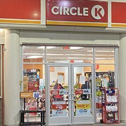 Circle K - The worker on the left and the boyfriend on the right. The paper blocking their faces are the "signs" she used to close the store down.